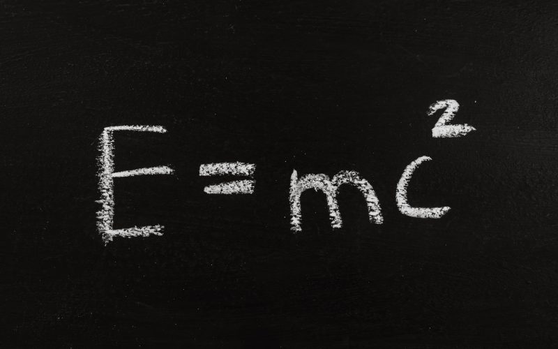 The calculation for mass energy equivalence ist standing on a chalkboard, physic formular